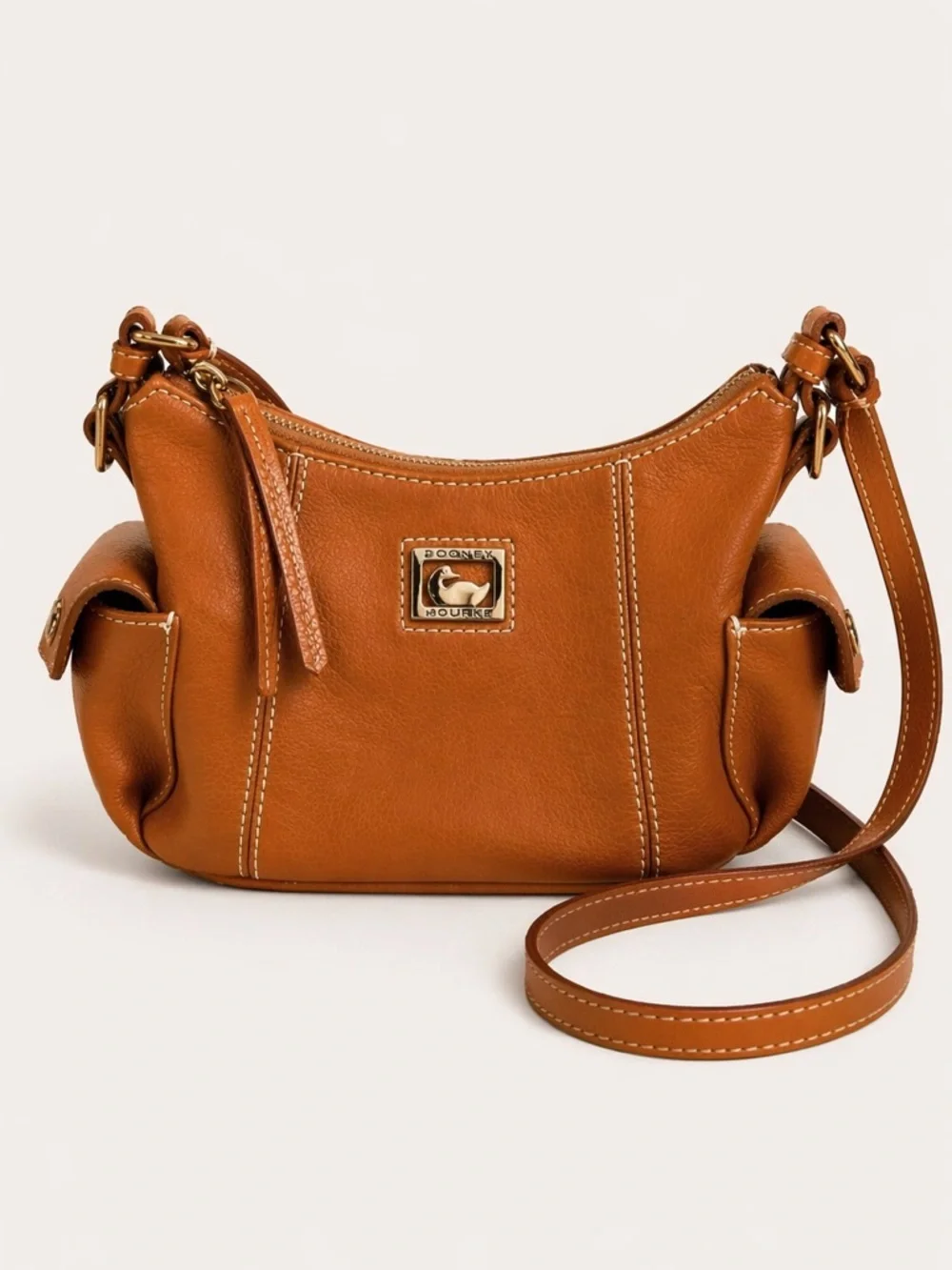 Dooney & Bourke Pebbled Grain Pocket Sac Crossbody with Side Pockets.